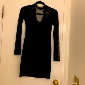 This Black Dress is mesh on top and a leather looking polyester on the bottom.
